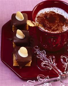 Sea buckthorn petit fours with marzipan and chocolate