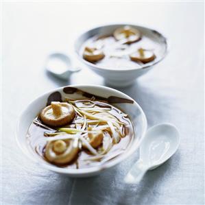 Asian rice noodles with mushrooms & spring onions in broth