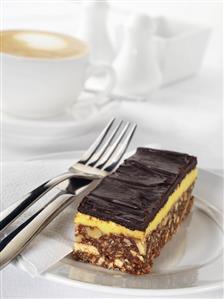 Chocolate nut slice with cup of cappuccino