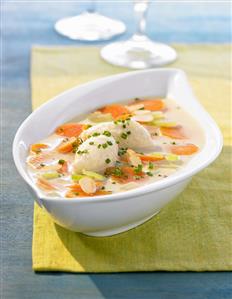 Cream of carrot soup with cheese dumplings