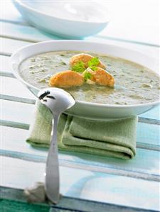 Cream of chard soup with cheese & pepper dumplings in soup plate