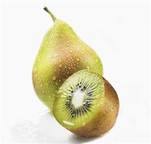 Pear with drops of water and half a kiwi fruit