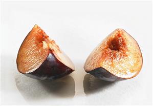 Two wedges of plum