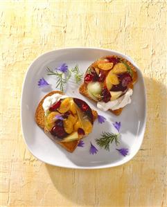 Zwieback topped with cream cheese and jellied fruit