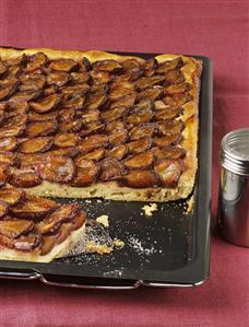 Zwetschgendatschi (plum cake) on baking tray