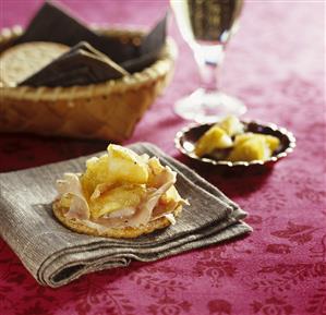 Ham and apple compote on cracker