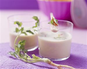 Cold lemon grass soup with coriander in two glasses