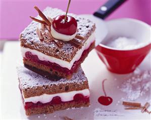 Chocolate sponge slices with cherries and yoghurt cream