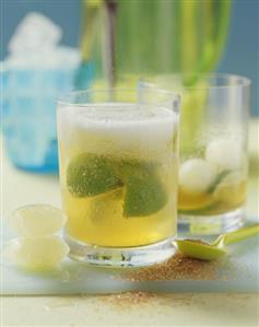 Two glasses of caipirinha punch with melon balls