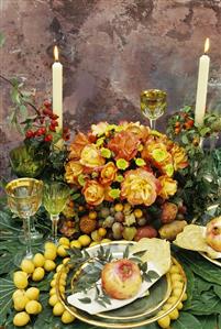 Summery table with fruit and roses out of doors