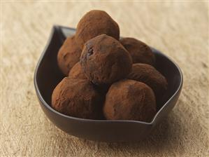 Amarettini truffles in small brown dish