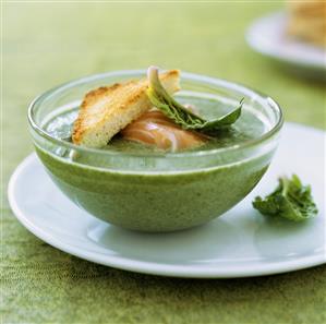 Herb soup with smoked salmon and toast triangle