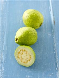 One half and two whole guavas