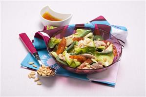 Apple, tuna and orange salad with pine nuts