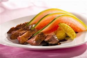 Roast duck breast with apple, melon and Calvados sauce