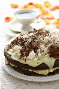 Chocolate cake with vanilla blancmange, halva and meringue