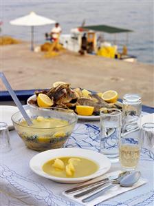 Greek fish soup with the sea in the background