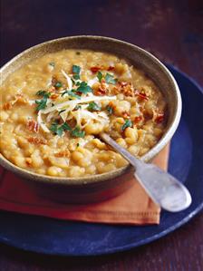 Yellow pea soup with pancetta, parsley and cheese