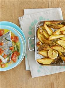 Sea bream fillet on tomato sauce, lemon & rosemary potatoes