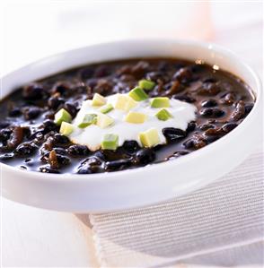 Black bean soup with sour cream and avocado