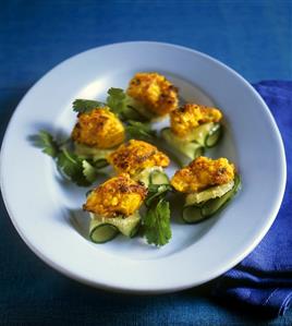 Chermoula fish on cucumber and lime slices