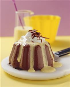 Chocolate blancmange with custard and cream