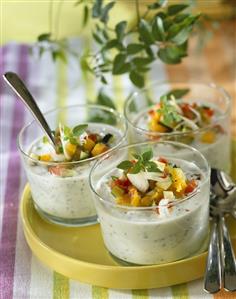 Herb soup with vegetables and fish fillet in glasses