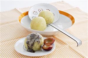 Plum dumplings with poppy seed butter