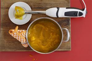 Pumpkin soup with hand blender