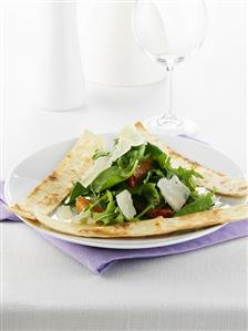 Green salad with orange segments, shaved cheese & pita bread