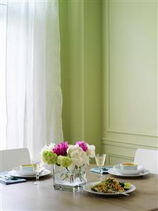 Tuna salad and soup on laid table in dining room