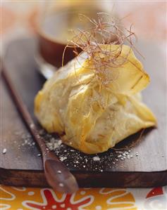 Baked banana in filo pastry with shreds of chilli