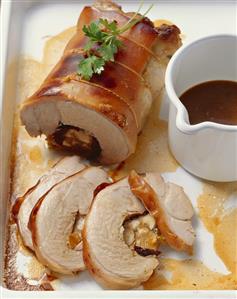 Rolled roast suckling pig with prunes and apricots