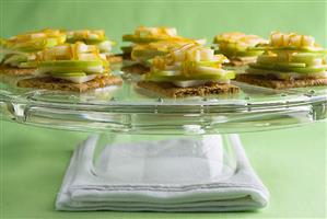 Graham crackers topped with apple & cheese slices & caramel