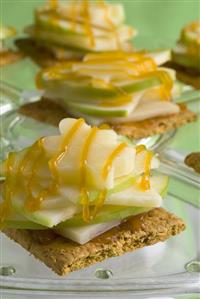 Graham crackers topped with apple & cheese slices & caramel