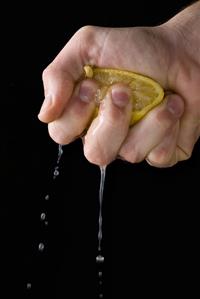 Squeezing a lemon by hand