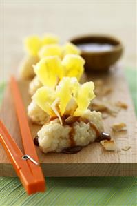 Sweet pineapple sushi with caramel sauce