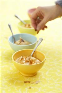 Pears with caramel sauce and flaked almonds