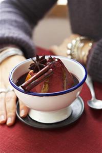 Pear poached in red wine with cinnamon stick & star anise