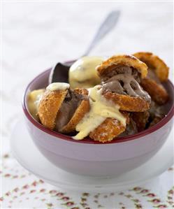 Profiteroles with chocolate ice cream and custard