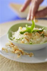 Rice pudding with lime peel and coconut flakes