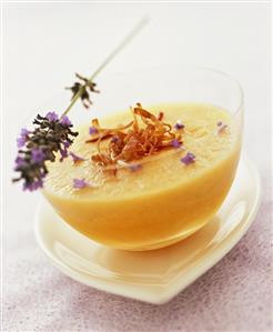 Chilled melon soup with lavender flowers