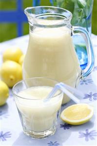 Lemonade in glass and carafe