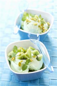 Pistachio ice cream with kiwi fruit and mint