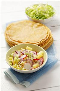 Radish and pineapple salad and pancakes