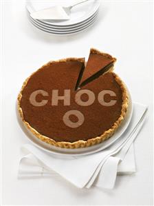 Chocolate tart with the word Choco, a piece cut