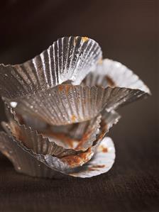 Silver foil cases with the remains of chocolate truffles