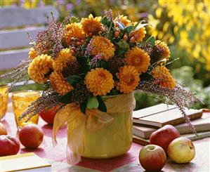 Vase of dahlias, heather and hypericum berries