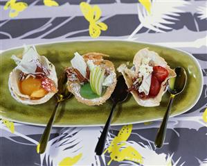 Apricot, apple and strawberry puree in wafer bowls