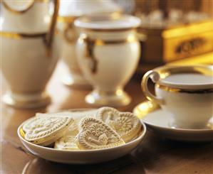 Heart-shaped Springerle (cookies) & gold-rimmed coffee set